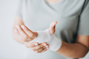 Person with bandage on wrist and hand